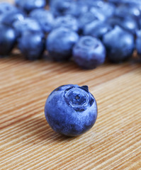 Blueberry on a table with other blueberries