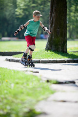 Little boy on rollerblades