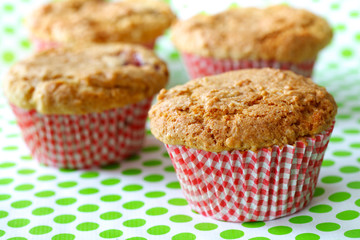 Rhubarb muffins freshly baked in red cups