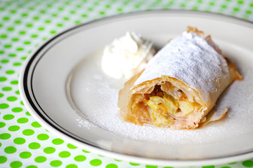 Apple and rhubarb strudel pastry with whipped cream