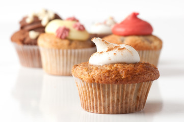 Apple and Cinamon Cupcake with other cupcakes in background