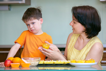 Cute little boy refuses to taste muffin