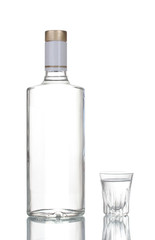 Bottle of vodka and wineglass isolated on white