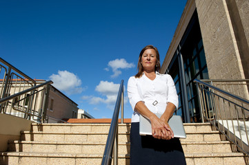 Confident Business Woman with Notebook Outdoor