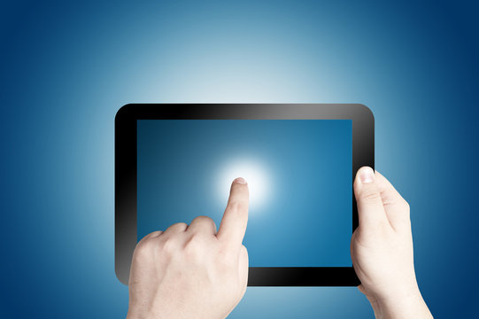 hand Holding Tablet PC on blue background