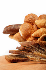 large variety of bread, still life isolate on a wooden table ove
