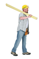Builder carrying timber