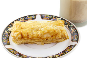 Pineapple pie with hot choco on white background