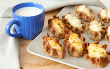 Traditional karelian pasties and cup of milk for breakfast