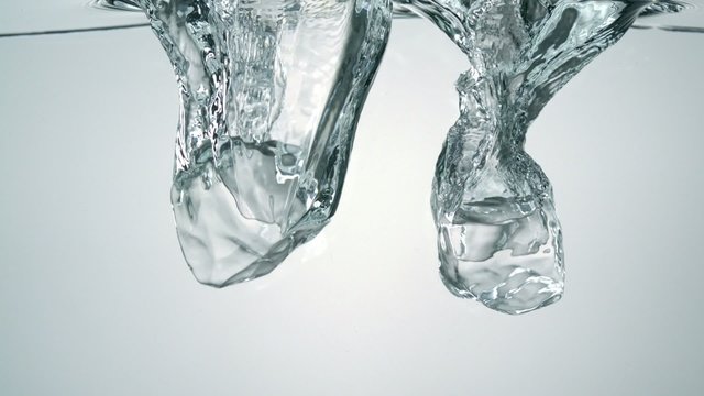 Dropping ice cubes in water, Slow Motion
