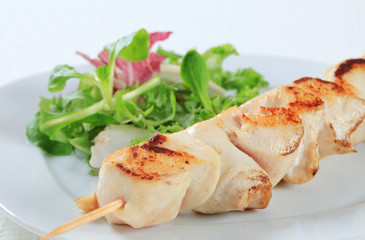 Chicken skewer with salad greens