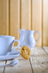 blue coffee cup and jug on white table