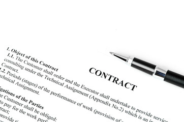 Close-up of silver pen on contract.