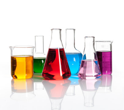 Set of laboratory flasks with a colored reagents, isolated