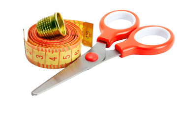 scissors , thimble and measuring tape
