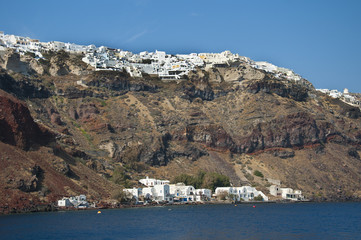 Oia clinging to the clifftops on island of Santorini Greece