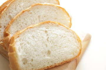 Sliced bread on wooden cutting board