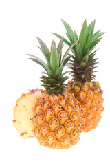 whole and half pineapples