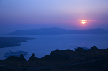 Fototapeta na wymiar Sunset over the Calder at Santorini Greece