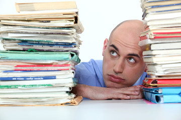Bald office worker swamped with work - obrazy, fototapety, plakaty