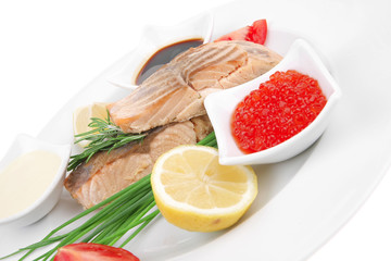 salmon fillet pieces roasted with lemon and rosemary twig