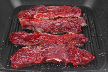 raw bloody beef steaks