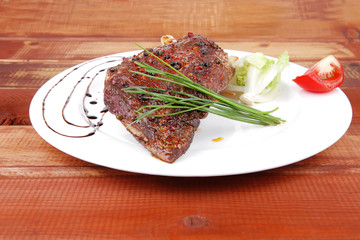 over wood: grlled shoulder on plate