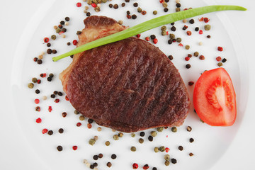 grilled beefsteak served with red tomato