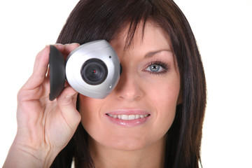 Fototapeta premium Studio shot of a woman with a webcam