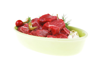 raw fresh beef meat slices in a ceramic dish