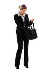 elegant woman in suit with bag