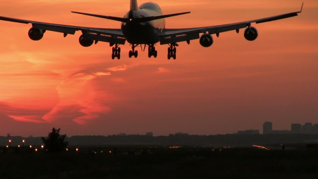 Jumbojet landing at dusk