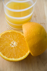 half of fresh orange and juice