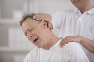 Chiropractic: Chiropractor doing neck adjustment - Powered by Adobe