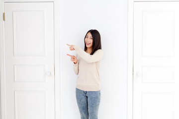 a young asian woman and two doors