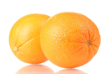 two ripe oranges isolated on white