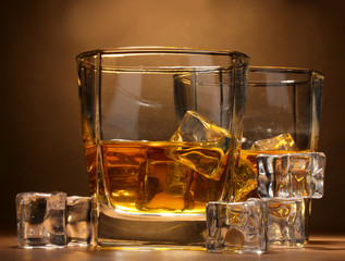 two glasses of scotch whiskey and ice