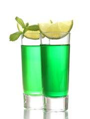 glasses of absinthe and lime isolated on white