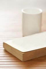 Book and white cup