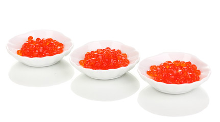 Red caviar in white bowls isolated on white