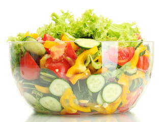 fresh vegetable salad in transparent bowl isolated on white