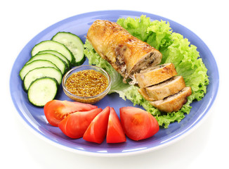 Tasty meat cutlet with garnish on plate isolated on white