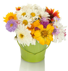 beautiful bouquet of bright  wildflowers in green metal bucket,