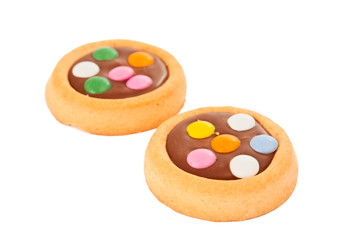 Biscuits with milk chocolate and coloured chocolate beans isolat