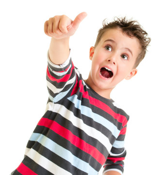 Little boy shows thumb up gesture