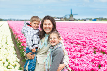 Mother with her child in tulips field