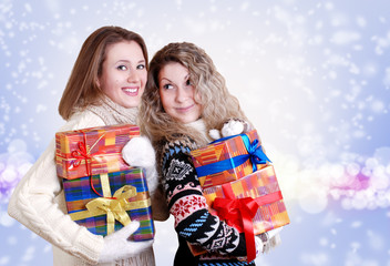 Happy girlfriends with christmas presents