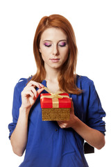 Beautiful red-haired girl with present box.