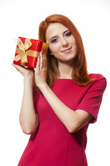 Beautiful red-haired girl with present box.