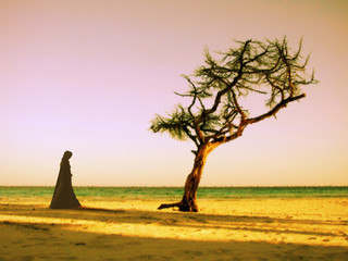 Naklejka premium mistic scene with tree and woman